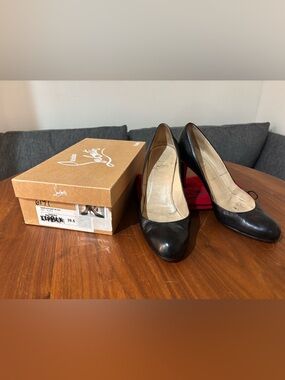 Christian Louboutin Black Leather Round-Toe Pumps with Signature Red Soles